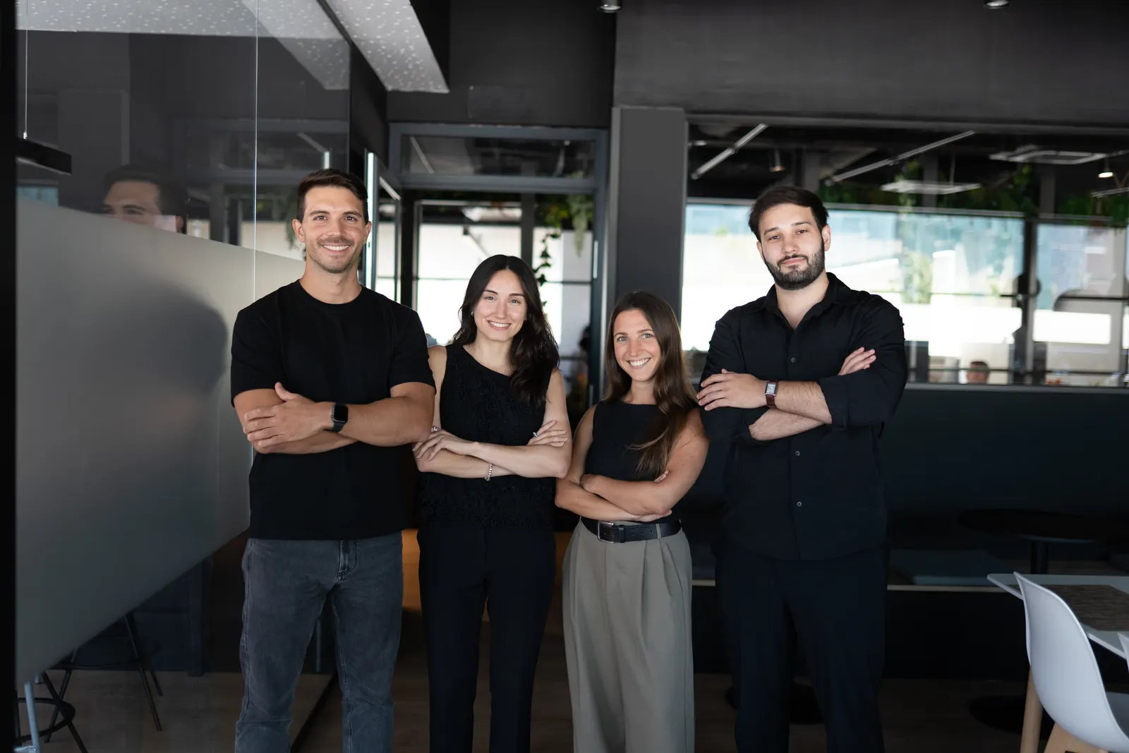 Four LaFinteca team members standing with arms crossed